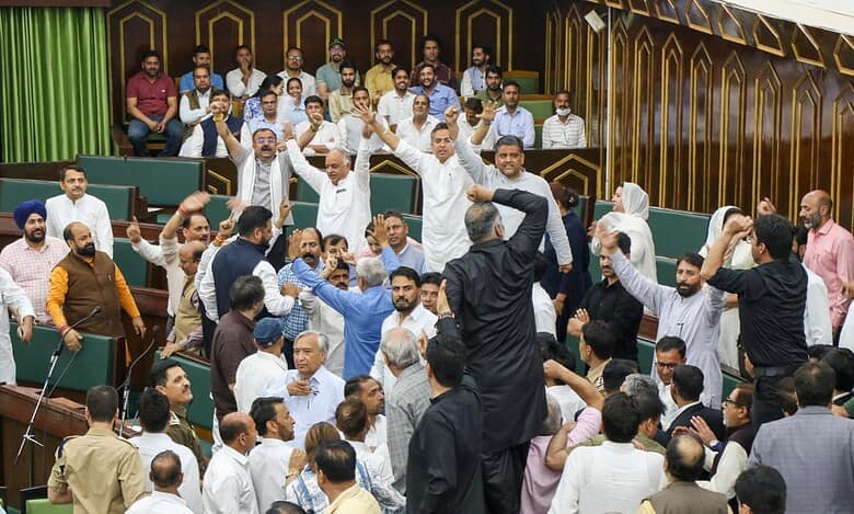 MLAs raise slogans during the Budget session of the J&K Assembly in Jammu on Monday.