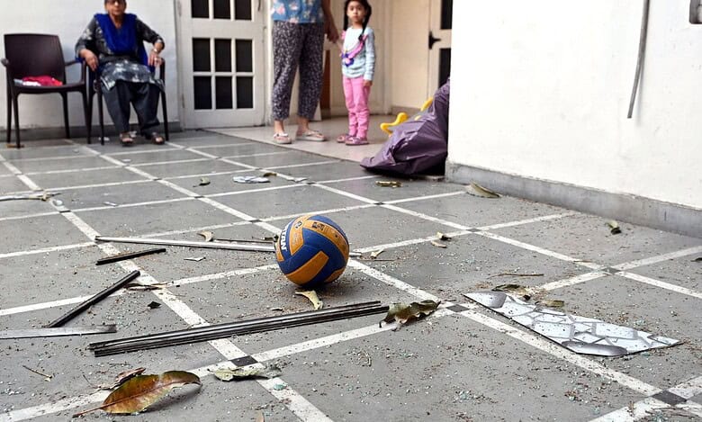 The image shows scattered glass inside the residence of of BJP leader Manoranjan Kalia on April 8, 2025