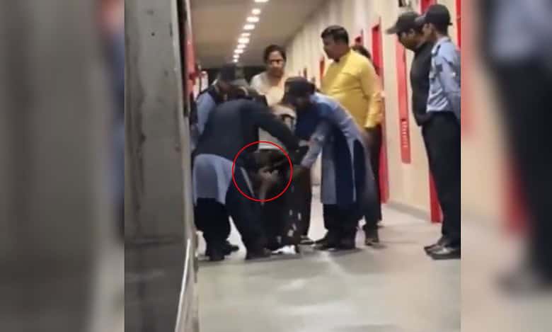 The image displays women security guards in a college based in Haryana unzipping a suitcase and a woman, in red circle, emerges out of it.