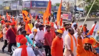 In the image, saffron clad Hindu devotees take part in Hanuman Jayanthi in Hyderabad