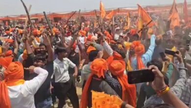 The image displays saffron clad men wielding swords at Karni Sena's "Rakt Swabhiman Sammelan" in Agra, Uttar Pradesh. Date April 12, 2025