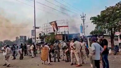 The image displays police officials with some locals in West Bengal's Murshidabad. April 13, 2025
