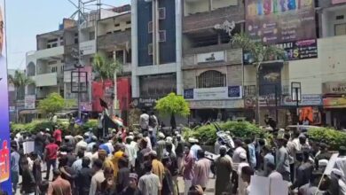 The image displays many men in Hyderabad protesting against the Waqf Amendment Act. April 13, 2025