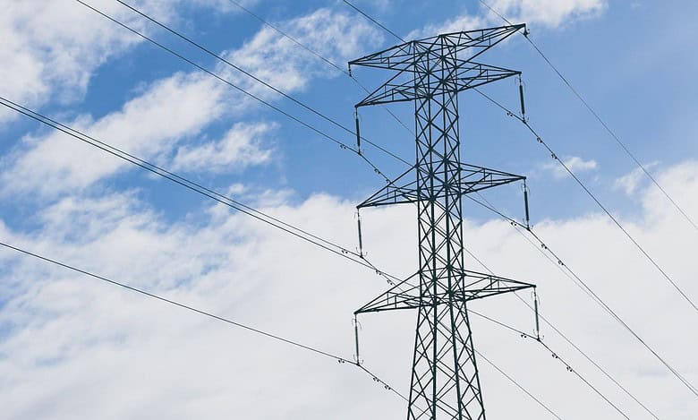 The image displays a representational image of an electricity tower. April 16, 2025