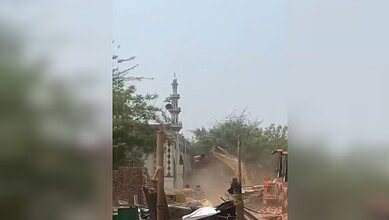 The image displays the demolition of a 50-year-old mosque in Haryana's Faridabad district. April 16, 20205