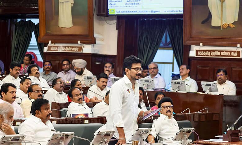 The image displays a picture of Tamil Nadu Deputy CM Udhaynidhi Stalin speaking at the Tamil Nadu Assembly