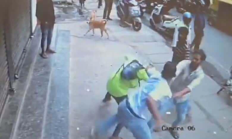 The image displays a CCTV footage of an Air Force officer attacking a biker in Bengaluru. April 21, 2025