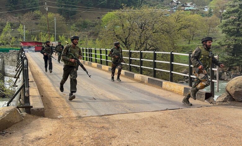 the image displays a picture of Army personnel after a firing incident was reported in Kashmir's Pahalgam