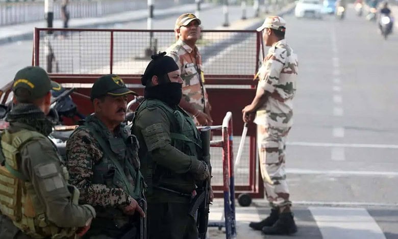 The image displays a picture of security forces personnel guarding a check point a day after Pahalgam terrorist attack in Jammu on Wednesday, April 23
