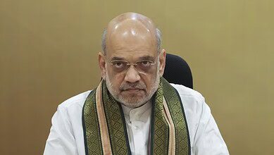 The image displays a picture of Union Home Minister Amit Shah