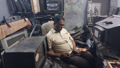 The image displays a picture of a man named Mohd Abdul Ishaq repairing old television sets in Hyderabad. April 26, 2025