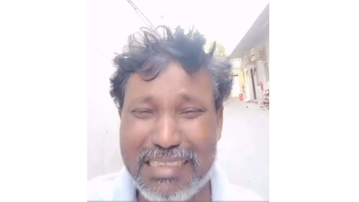 The image displays a picture of a stranded Telangana Gulf worker. April 26, 2025