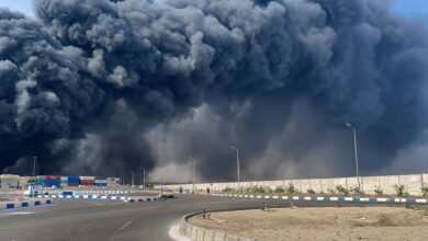 The image shows thick smoke billowing from an Iranian port after a blast was reported, leaving over 400 injured.