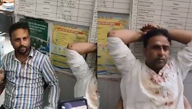 The image shows two brothers soaked in blood after they were attacked by an angry mob in Bihar