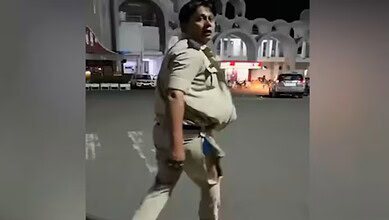 The image displays a picture of a GRP officer with his uniform ripped off from a scuffle in Bhopal