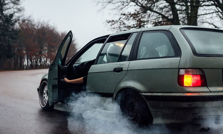 Representational Image of car emitting smoke