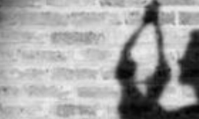 Representational Image of man hanging himself