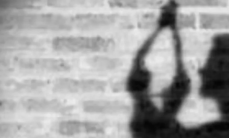 Representational Image of man hanging himself