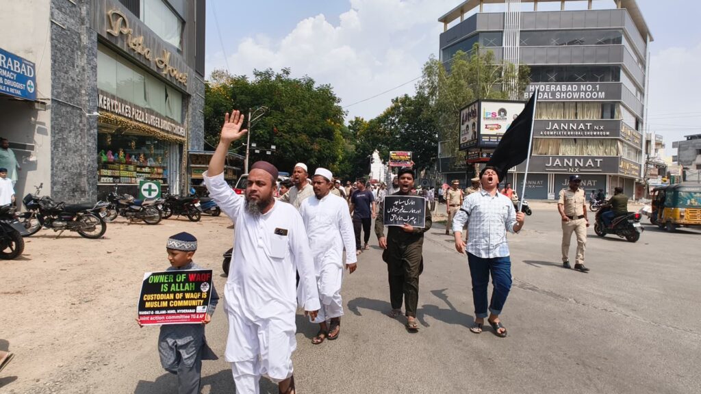 Protesters holding anti-Waqf Act placards at Saidabad