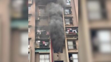 Woman dangles child from balcony as fire engulfs Ahmedabad building