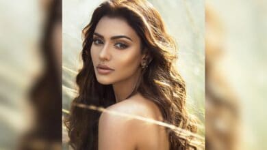 Actress Nusraat Faria looks over her shoulder in a serene outdoor portrait amid political turmoil and legal actions in Bangladesh