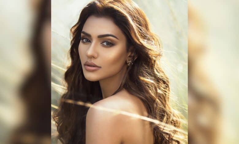 Actress Nusraat Faria looks over her shoulder in a serene outdoor portrait amid political turmoil and legal actions in Bangladesh