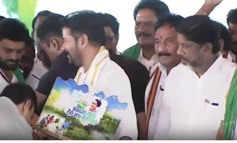The image shows principal secretary of tribal welfare department A Sharath trying to touch the feet of chief minister A Revanth Reddy during an official programme held at Macharam village in Nagarkurnool district on Monday, May 19.