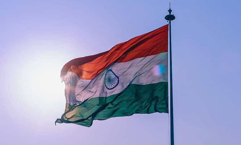The India flag hoised on a pole with the sun behing for a flag march story in Hyderabad