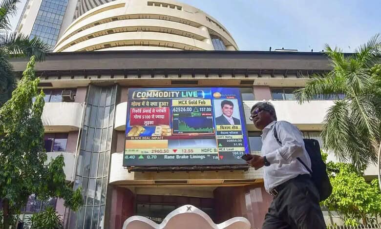Mumbai: A man walks past the Bombay Stock Exchange (BSE) building, in Mumbai, Tuesday, Dec. 5, 2023. Sensex on Tuesday jumped 169.94 points to fresh peak of 69,035.06 in early trade; Nifty climbed 52.60 points to hit record high of 20,739.40. (PTI Photo)
