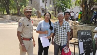 Rachakonda police official standing alongside the NEET student and her guardian after assisting them in reaching the correct exam location
