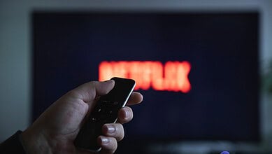 Someone switching on the TV to watch Netflix for ban on Pakistani content on OTT platforms