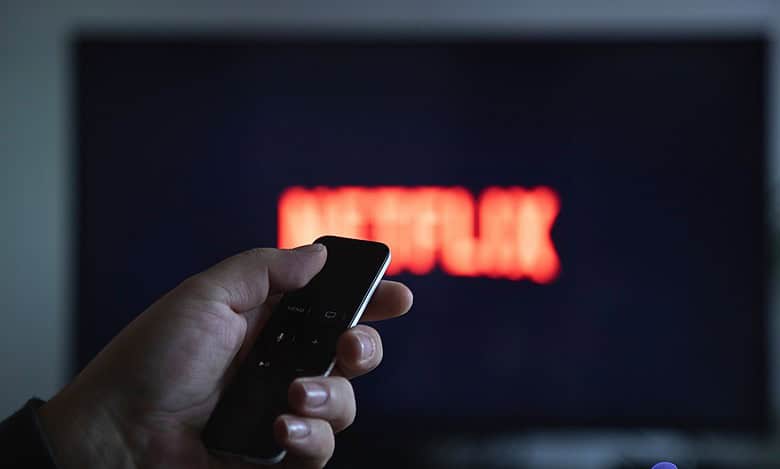 Someone switching on the TV to watch Netflix for ban on Pakistani content on OTT platforms