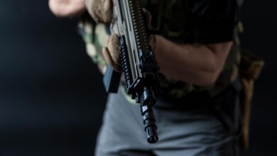 Representational Image of man holding a gun