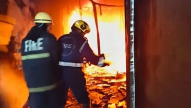 The image shows fighters trying to douse the fire at Gulzar Houz near Charminar in Hyderabad