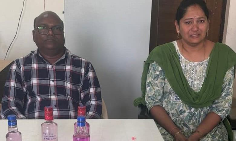Two government officials, a man and a woman seated after being caught red-handed by ACB for accepting bribe