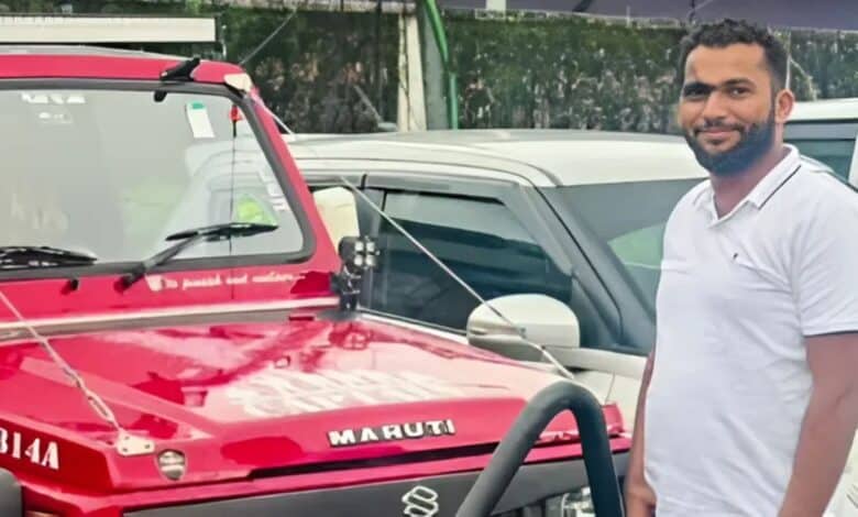 The image displays a picture of man with a red jeep