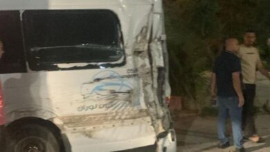 The image display a picture of a crushed van carrying Palestinian Haj pilgrims