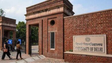 The image displays a picture of Delhi University