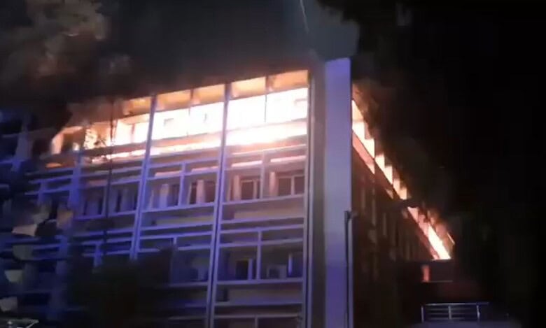 The image displays a building caught in a fire accident in Secunderabad on Sunday