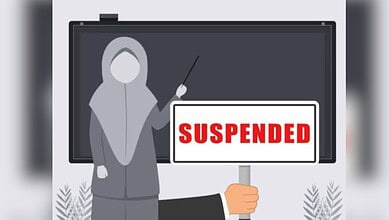 The image shows a picture of Muslim teacher suspended
