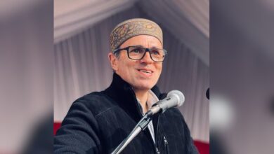 The image displays a picture of J&K chief minister Omar Abdullah