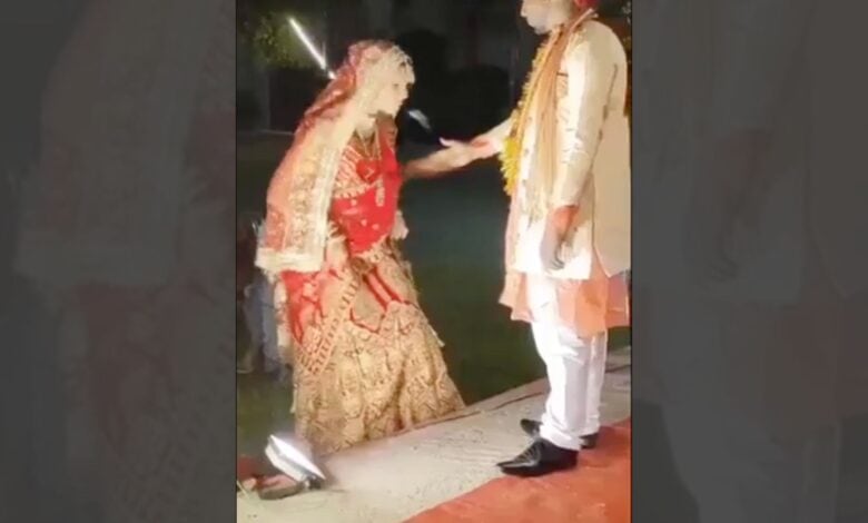 Bride spits on bridegrooms hand