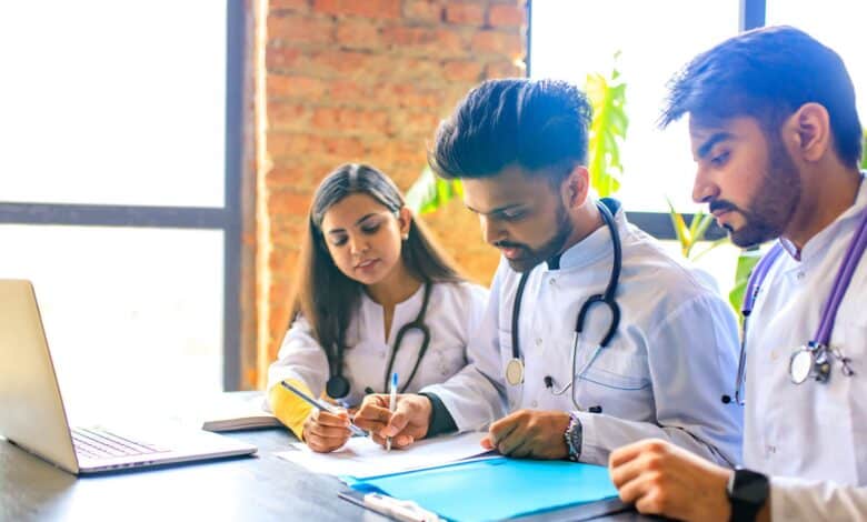 The image displays a picture of medical students