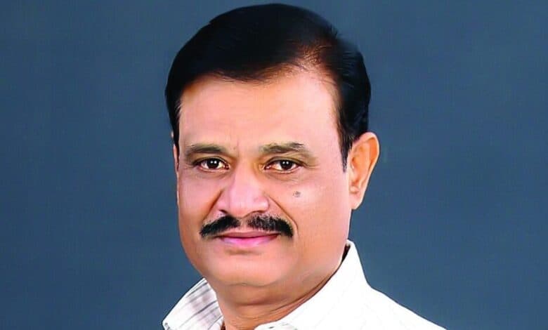 The image displays a picture of Karnataka BJP MLA Munirathna