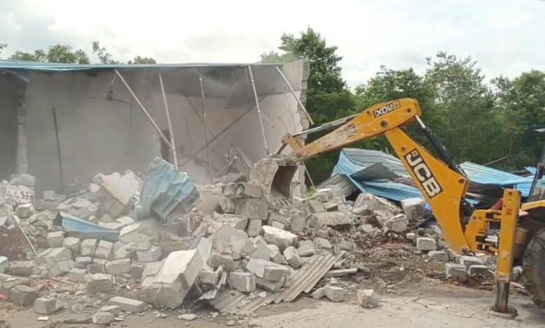 The image displays a HYDRAA demolition in Medchal-Malkajgiri district.