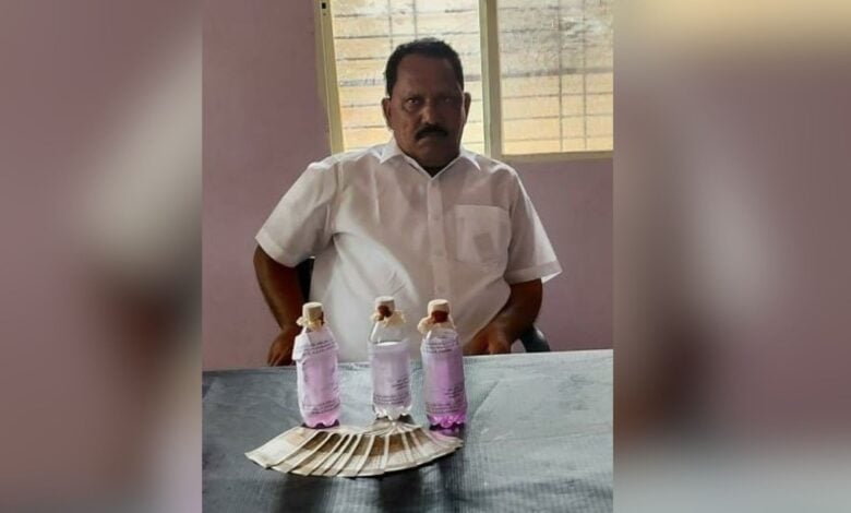 The image displays a picture of Nirmal government officer caught for bribery by Telangana ACB