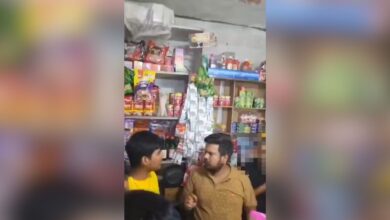 The image displays a picture of a man in brown T-shirt angrily questioning a boy in yellow T-shirt at a grocery shop