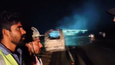 Fire fighters arrive on the Suryapet- Khammam Highway where the bus caught fire