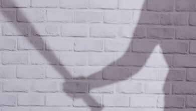 Representational Image of man holding a stick