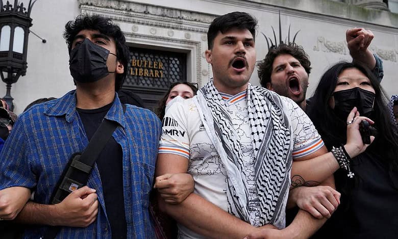 Students link arms during a pro-Palestinian protest outside Butler Library at Columbia University in New York, May 7.